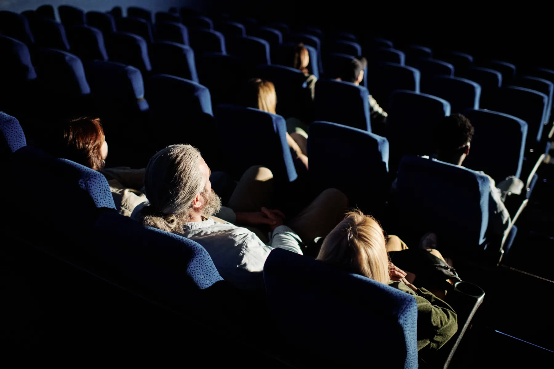 people on seats at cinema