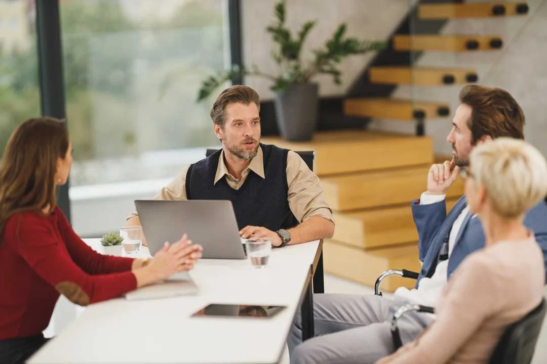 Team members attending a company meeting