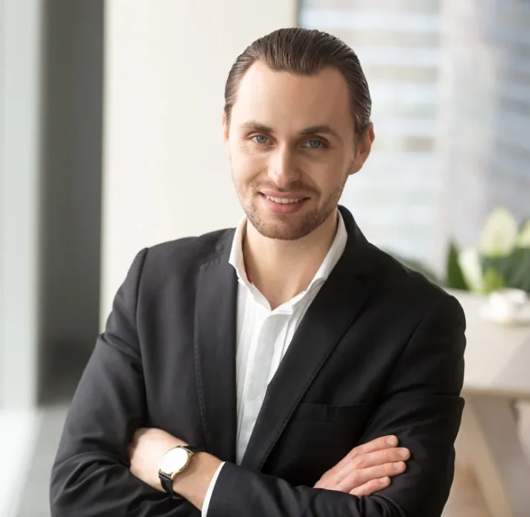 Confident businessman in a formal suit standing professionally, representing leadership, ambition, and business success.