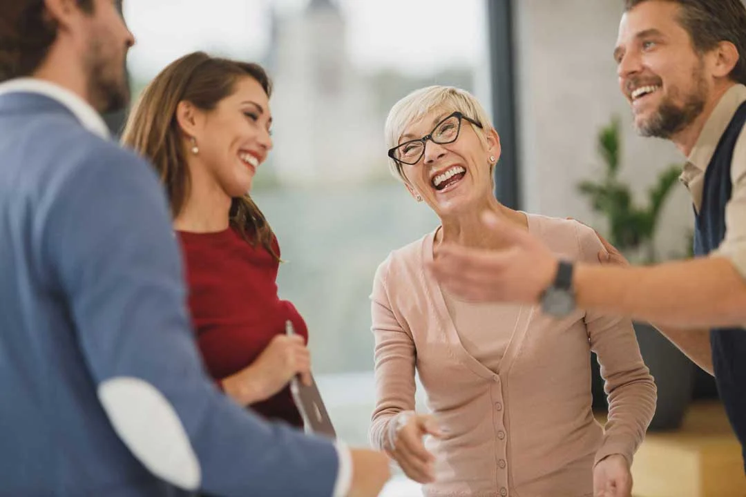 Woman team member laughing during a discussion